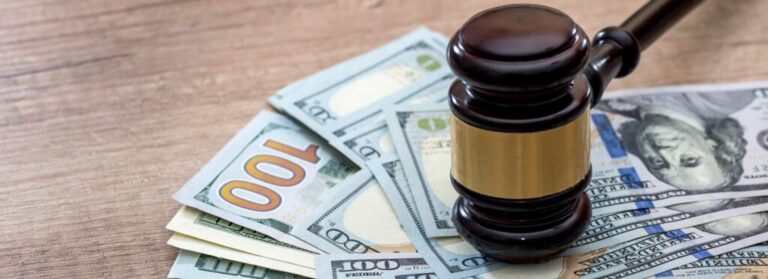 Lawsuit Settlement Concept With Money and Gavel