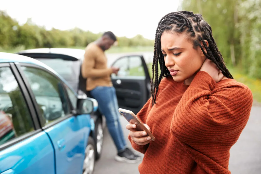 Woman on Phone After Car Accident