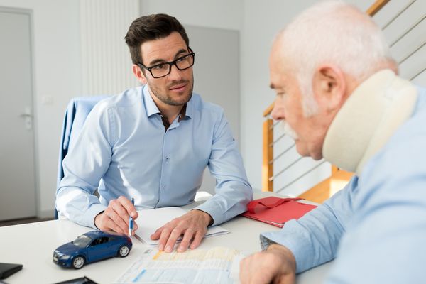 Wilmington car accident lawyer speaks with injured client