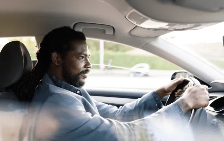 man driving car