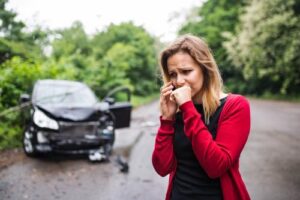 A woman calling an attorney after a hit and run accident.