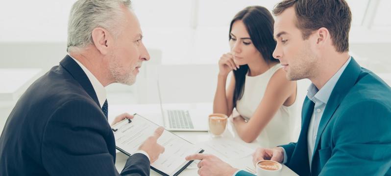 This image shows a Georgia personal injury lawyer discussing a claim with his client.