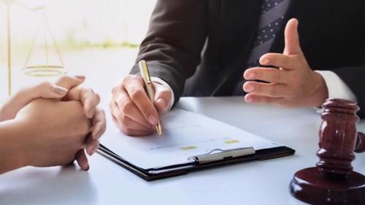 Two people reviewing a legal document