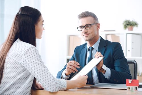 A woman reviewing a claim with an Atlanta uninsured motorist accident lawyer.