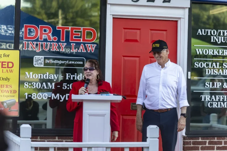 Elaine Mann speaking beside Ted Greve at the Shelby championship celebration