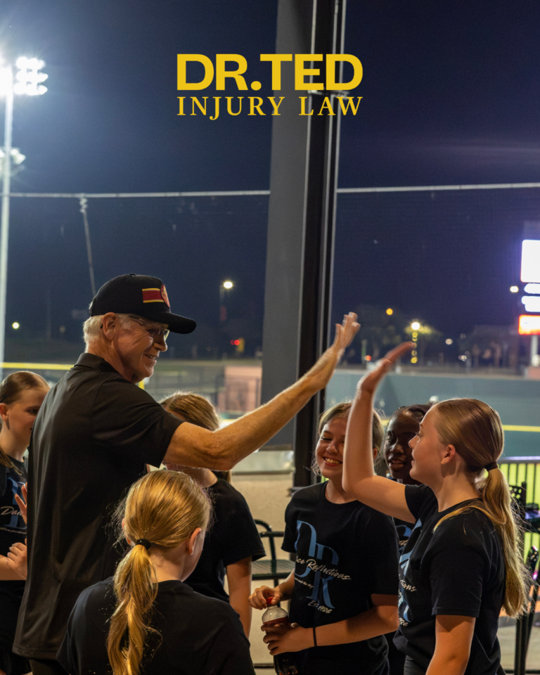 Dr. Ted Greve exchanges high-fives with Dance Reflections dancers at CaroMont Health Park.